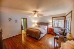 Spacious Master Bedroom with windows overlooking the lake and attached full bath